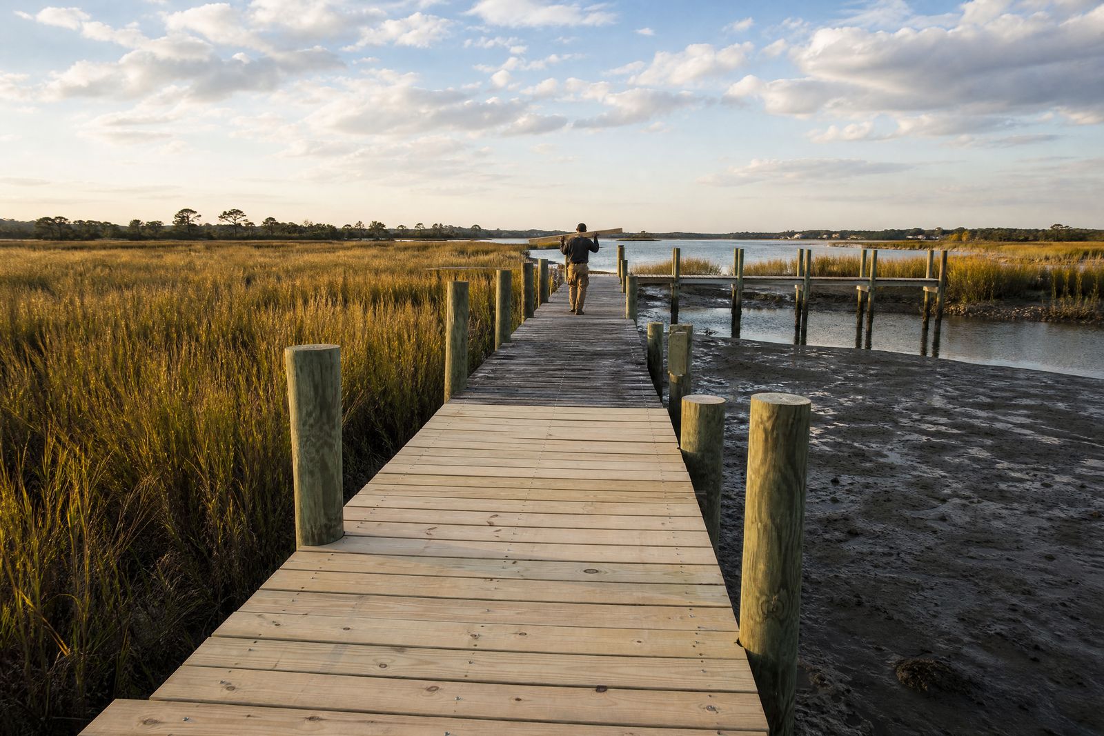 Dock & Pier Restoration in Charleston, SC: private dock over the salt marsh with newly replaced boards near Charleston, SC